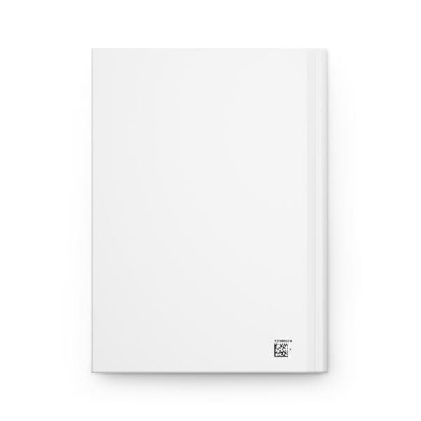 A white book with a silver square on the front cover.